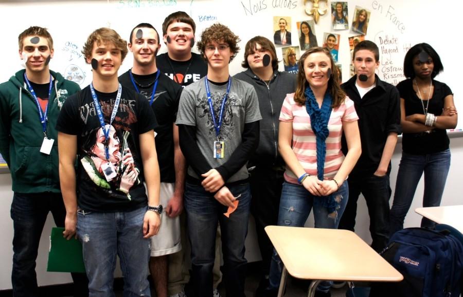 Students of French Club gather at the end of a game called